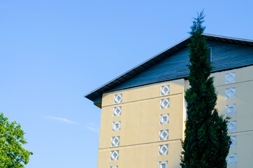 Yellow facade with patterns of an apartment building