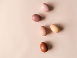 Set of Easter eggs varios colored on beige background