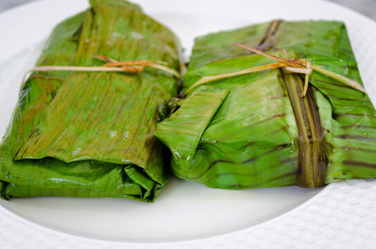 Closeup of fish covered and fried in banana leaf in traditional Kerala style (Meen Pollichathu)