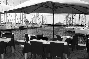 Rome port view through the tables of a restaurant