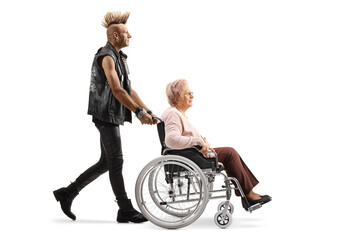 Punk rocker pushing an elderly woman in a wheelchair