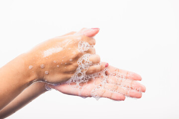 Closeup young Asian woman washing hands by soap for cleanliness and prevent germs coronavirus, studio shot isolated on white background, Healthcare medical COVID-19 virus concept