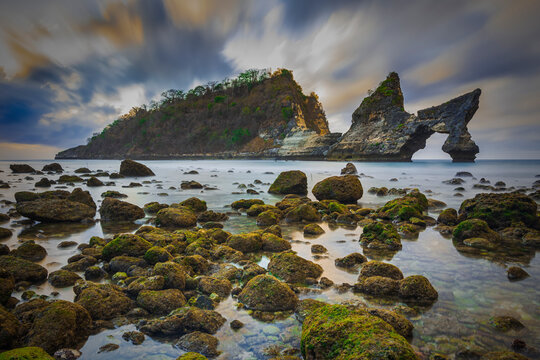 rocks on the beach at sunrise, nusa penida, bali, indonesia