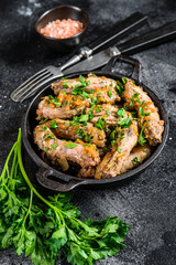 Stew with Chicken Neck meat and vegetables. Black background. Top view