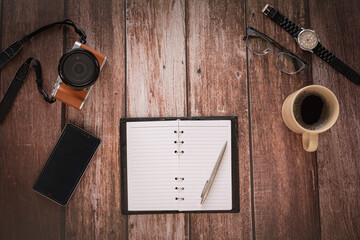 Overhead view of Traveler's accessories on wooden table background