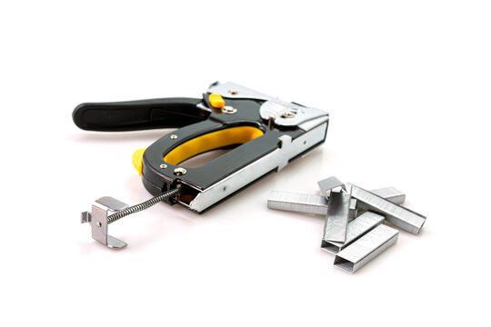 Construction stapler and staples isolated on white background