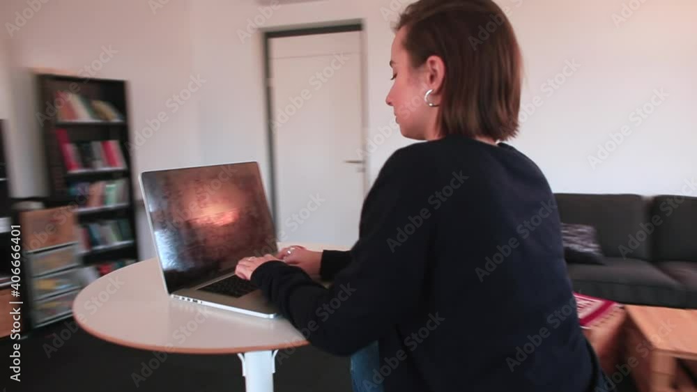 Poster office worker doing computer work while sitting at the table. preparing a text document using a lapt