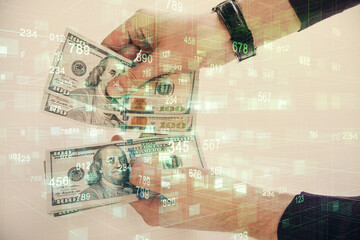 Multi exposure of technology drawing hologram and us dollars bills and man hands. Data concept