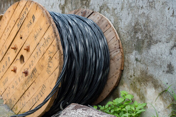 Fototapeta premium A close up shot of heavy overhead cable roll for electrical power supply used in power grids.
