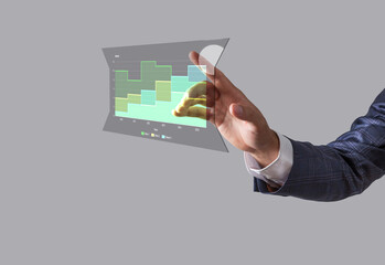 Business man toucing screen and showing holographic graphs and stock market statistics gain profits. Concept of growth planning and business strategy.