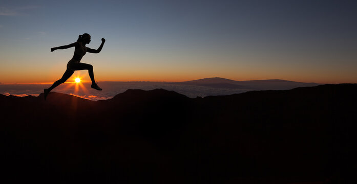 Runner during sunset - fitness work out concept