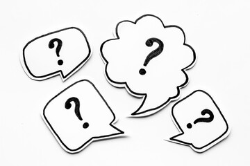 Question mark on paper bubbles, top view. Question concept