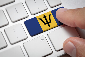 Online International Business concept: Computer key with the Barbados on it. Male hand pressing...