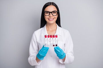 Photo of doctor lady hold laboratory samples wear gloves glasses stethoscope white uniform isolated...