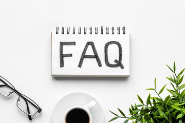 FAQ - fequently asked question - on table ofiice table. Top view