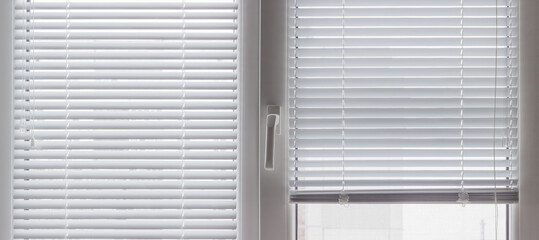 Fragment of modern window with Venetian blinds, inside view
