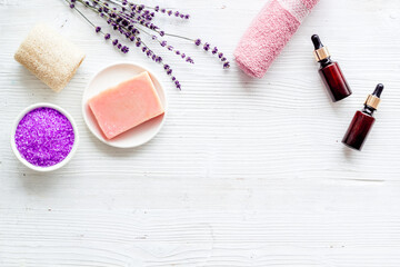 Obraz na płótnie Canvas Frame of lavender cosmetics products with natural essential oil and herbs salt