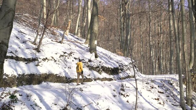 Image of man hiking Sljeme mountain during winter, Zagreb, Croatia.