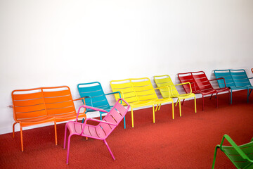 Colorful chairs in an empty room in playgound zone