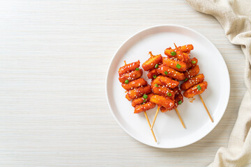 deep fried Korean rice cake (Tteokbokki) skewered with spicy sauce