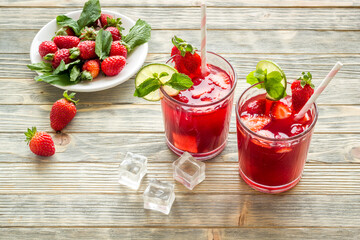 Fresh strawberry cocktail drink with ice, top view