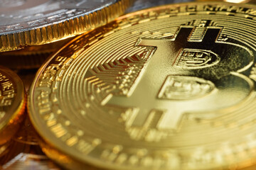 Close up of golden bitcoin currency.
