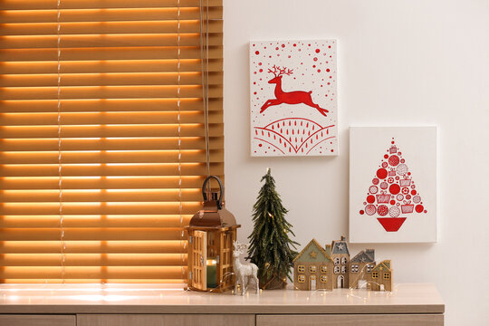 Beautiful Christmas pictures in decorated room. Interior design