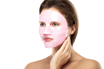 Young beautiful woman with rubber facial mask on her face