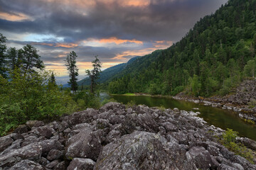 Cloudy evening landscape on the lake.