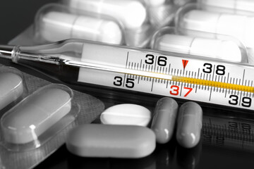 Mercury thermometer and pills