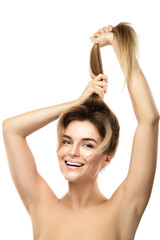 Fototapeta premium Beautiful woman is very happy of her hair growth progress