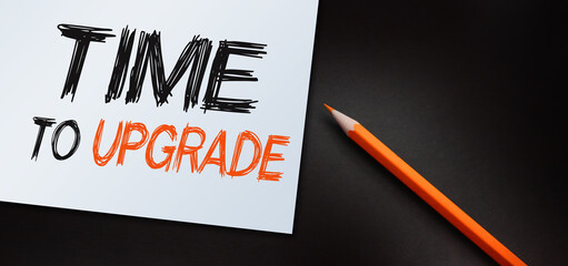 time to upgrade text write on paper. Technology and business concept
