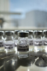 canisters with covid-19 vaccines