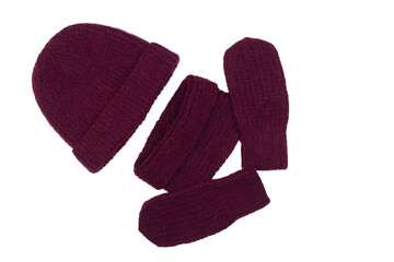 knitted red mittens and hat on a white background