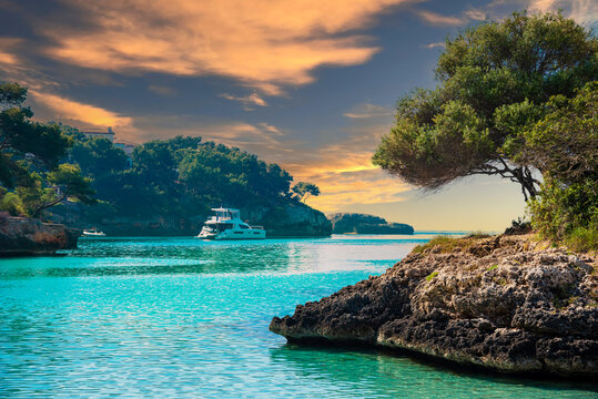 Beautiful landscape of the coast and beach at sunset in Playa de Cala Ferrera on Mallorca island - Spain