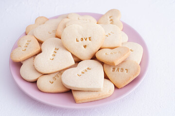 Heart shaped cookie plate with the word LOVE. Valentine's Day concept.