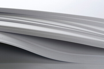 Closeup of stack of new white paper as a background