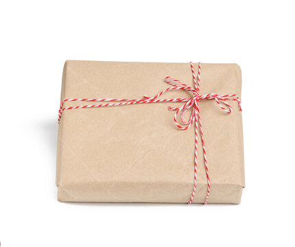 box wrapped in brown kraft paper and tied with red rope