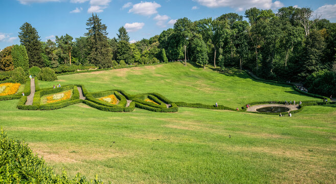  Colorful traditional English garden and flowering flower beds. Arboretum Sofievka in the city of Uman, Ukraine