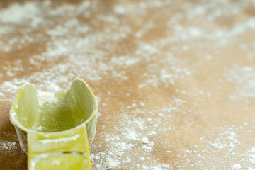 Measuring cup prepared with flour for dough