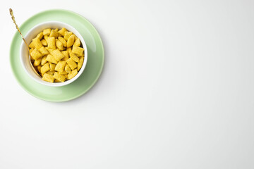 cornflakes and muesli in a plate on a table