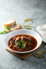 Traditional homemade beef goulash with fresh parsley