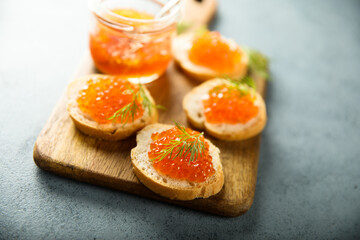 Red caviar on toast with dill
