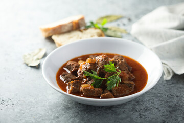 Traditional homemade beef goulash with fresh parsley