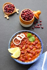 Rajma curry is a popular North Indian Food. Rajma is a socked Red kidney beans cooked with onions, tomatoes and a special blend of spices. Served with Jeera rice or Cumin Rice. With Copy Space.