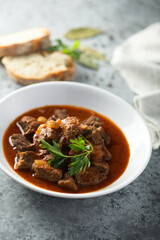 Traditional homemade beef goulash with fresh parsley