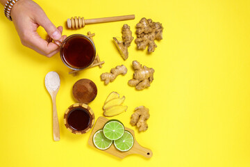 Ginger root and honey lime green. Dry ginger. yellow Background. view from the top. space for copying text