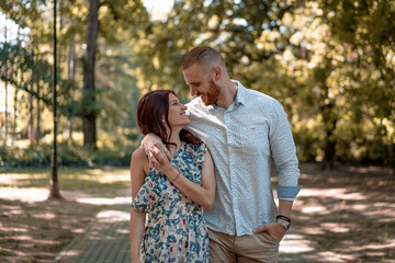 Beautiful young couple in park. Love and emotions concept.