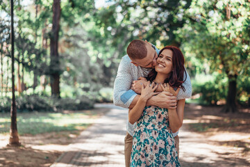 Beautiful young couple in park. Love and emotions concept.