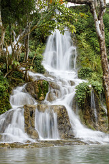 Fototapeta na wymiar The beautiful waterfall atmosphere in forest